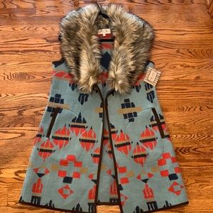 Tasha Polizzi faux fur sleeelss jacket